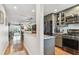 Open-concept kitchen featuring stainless steel appliances, granite countertops, and sleek cabinetry at 2960 59Th S St # 614, Gulfport, FL 33707