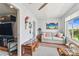 Cozy sunroom with comfortable seating and decor with view of adjacent room at 2960 59Th S St # 614, Gulfport, FL 33707