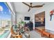 Bright sunroom area with natural light and an adjacent office space at 2960 59Th S St # 614, Gulfport, FL 33707