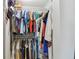 A walk-in closet with metal racks filled with clothes and personal items at 2960 59Th S St # 614, Gulfport, FL 33707