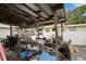 Outdoor patio area cluttered with storage items and various equipment at 3008 Jackson N St, St Petersburg, FL 33704