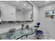 Modern bathroom with glass countertop and mosaic mirror details at 3008 Jackson N St, St Petersburg, FL 33704