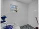 Bathroom featuring tiled walls and a decorative stained glass window at 3008 Jackson N St, St Petersburg, FL 33704