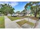 Corner lot home featuring well-manicured lawn and convenient sidewalk access to the property at 3008 Jackson N St, St Petersburg, FL 33704
