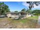 Traditional home with a cozy front porch and well-kept lawn at 3008 Jackson N St, St Petersburg, FL 33704