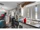Cluttered kitchen features a window, sink, and various disorganized items at 3008 Jackson N St, St Petersburg, FL 33704