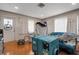 Inviting living room with hardwood floors, featuring a comfortable couch and an abundance of natural light at 3008 Jackson N St, St Petersburg, FL 33704