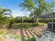 Expansive backyard featuring a patio, lush greenery, a fire pit and mature trees at 3305 10Th N Ave, St Petersburg, FL 33713