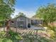 View of the back of the home highlighting the lush yard, patio and pergola at 3305 10Th N Ave, St Petersburg, FL 33713