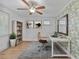 Stylish home office with a ceiling fan, leafy wallpaper, and bright natural light at 3305 10Th N Ave, St Petersburg, FL 33713