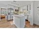 Bright kitchen with white cabinets, stainless steel appliances, and island at 3305 10Th N Ave, St Petersburg, FL 33713