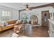 Bright living room featuring a leather sofa, wood accents, and plenty of natural light at 3305 10Th N Ave, St Petersburg, FL 33713