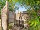 An outdoor shower provides a refreshing escape, surrounded by privacy fence and lush greenery at 3305 10Th N Ave, St Petersburg, FL 33713