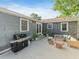 Back patio with outdoor seating, grill, and a serene backyard view at 3305 10Th N Ave, St Petersburg, FL 33713