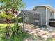 A wooden pergola stands proudly next to the home's rear, offering shade and style at 3305 10Th N Ave, St Petersburg, FL 33713