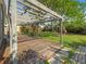 Pergola with a wood deck and tile pathway surrounded by lush landscaping in the backyard at 3305 10Th N Ave, St Petersburg, FL 33713