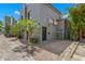 Modern home boasting a unique facade, brick driveway, and mature palm trees at 345 8Th Ne Ave, St Petersburg, FL 33701
