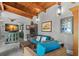 Cozy living room with exposed wood beam ceiling, stylish furnishings, and open kitchen view at 345 8Th Ne Ave, St Petersburg, FL 33701