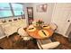 Charming dining area with a wooden table set for an elegant meal at 35031 Shale St, Webster, FL 33597