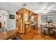 Dining area featuring wood accents, bar seating, and adjacent dining table at 35031 Shale St, Webster, FL 33597