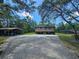 Exterior view of house with carport and pool at 35031 Shale St, Webster, FL 33597