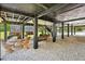 Spacious under deck with seating, swings, and views of the pool area. Ready for Gathering gatherings at 35031 Shale St, Webster, FL 33597