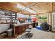Spacious workshop with a large workbench, shelving, and a window for natural light at 35031 Shale St, Webster, FL 33597