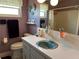 Bathroom featuring blue sink, lilac walls and colorful shower curtain at 3827 15Th N Ave, St Petersburg, FL 33713