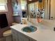Bathroom featuring blue sink, lilac walls and colorful shower curtain at 3827 15Th N Ave, St Petersburg, FL 33713