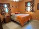Bright bedroom with orange walls and patterned curtains, creating a cozy and inviting space at 3827 15Th N Ave, St Petersburg, FL 33713