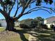 Charming exterior view featuring a large shady tree in front yard at 3827 15Th N Ave, St Petersburg, FL 33713