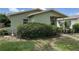 Modest single-story home featuring lush front yard landscaping at 3827 15Th N Ave, St Petersburg, FL 33713