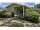Charming single-story home with lush landscaping, walkway and cozy front porch at 3827 15Th N Ave, St Petersburg, FL 33713