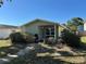 Charming home featuring a well-maintained front yard with lush greenery and welcoming walkway at 3827 15Th N Ave, St Petersburg, FL 33713