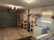 Spacious garage with ample storage, a workbench, and laundry machines, perfect for projects and chores at 3827 15Th N Ave, St Petersburg, FL 33713