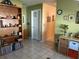 Hallway with tile flooring, neutral paint, and decorated with pictures and a bookcase at 3827 15Th N Ave, St Petersburg, FL 33713