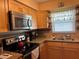Well-equipped kitchen featuring granite countertops and a stainless steel microwave at 3827 15Th N Ave, St Petersburg, FL 33713