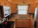 Well-appointed kitchen with wood cabinetry, granite countertops, and modern appliances at 3827 15Th N Ave, St Petersburg, FL 33713