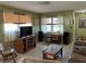 Cozy living room featuring tile floors, neutral tones, and comfortable furnishings at 3827 15Th N Ave, St Petersburg, FL 33713