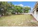 Expansive backyard with mature trees, providing a private outdoor retreat at 4312 Las Vegas Dr, New Port Richey, FL 34653