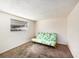 Bedroom featuring a window and a vibrant futon for flexible living spaces at 4312 Las Vegas Dr, New Port Richey, FL 34653