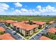 Aerial view of the building complex, showcasing the beautiful landscaping, parking and nearby wetlands at 4333 Bayside Village Dr # 110, Tampa, FL 33615