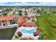 Aerial view showcases community pool, surrounding landscaping, and multiple residential buildings at 4333 Bayside Village Dr # 110, Tampa, FL 33615
