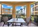 Relaxing balcony with outdoor seating and views of lush landscaping and a building exterior at 4333 Bayside Village Dr # 110, Tampa, FL 33615