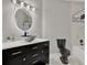 Stylish bathroom featuring a modern vanity with a unique vessel sink, illuminated mirror and tub with tiled wall at 4333 Bayside Village Dr # 110, Tampa, FL 33615