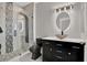 Modern bathroom featuring a unique glass bowl sink, backlit mirror, and tiled shower with a rainfall shower head at 4333 Bayside Village Dr # 110, Tampa, FL 33615