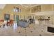 Large clubhouse with open floor plan, lounge seating, dining area and piano at 4333 Bayside Village Dr # 110, Tampa, FL 33615