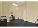 Bright office space featuring desk, chair, computer, and printer, ideal for remote work at 4333 Bayside Village Dr # 110, Tampa, FL 33615