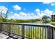 Beautiful lake view from the boardwalk with lush greenery in the background at 4333 Bayside Village Dr # 110, Tampa, FL 33615