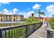 Scenic water view of the complex from a community boardwalk and lush vegetation at 4333 Bayside Village Dr # 110, Tampa, FL 33615